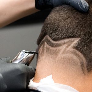 Custom design haircut in progress.